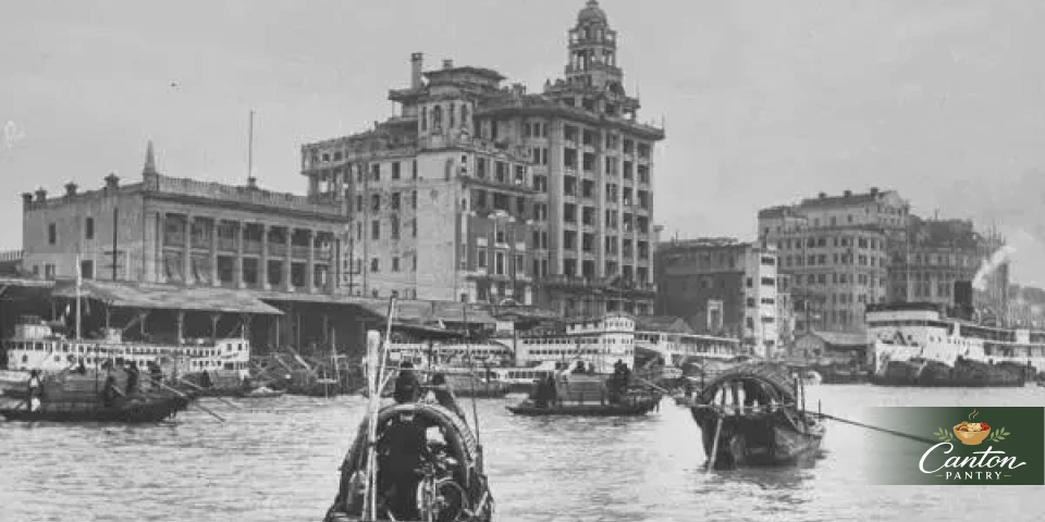 Historic riverfront scene on the Pearl River showing boats and old waterfront buildings
