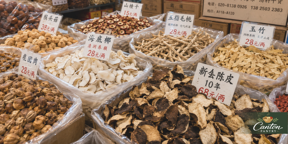 Close-up of dried tangerine peel, sea coconut, five finger fig root, and other soup ingredients
